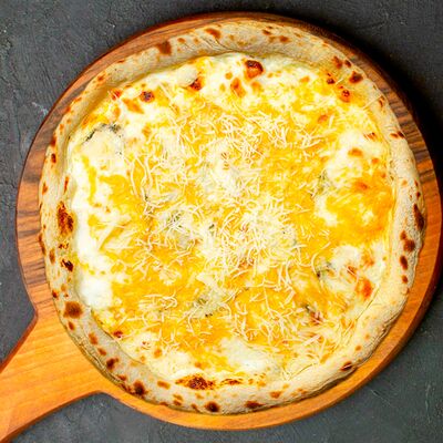 Четыре сыра 32 см в Томат по цене 975 ₽