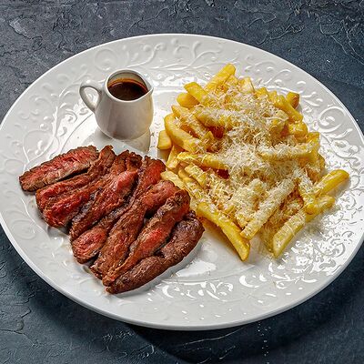 Стейк вегас с трюфельным картофелем фри и пармезаномв Этажи по цене 1100 ₽