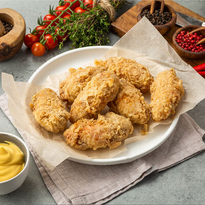 Крылья в панировкев Вкусный цыпленок по цене 595 ₽