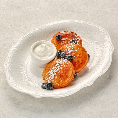 Оладьи со сметаной в Пармезан по цене 499 ₽