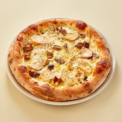 Пицца с курицей и белыми грибами в Регано по цене 1235 ₽