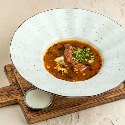 Мясная солянка с колбасками и копченым ребрышком в Brasserie Kriek по цене 760 ₽