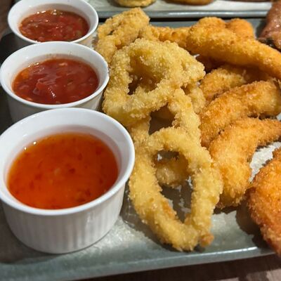 Кальмары в хрустящей панировке в Игристо по цене 590 ₽