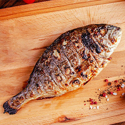 Дорадо на углях в Гриль Мания по цене 695 ₽