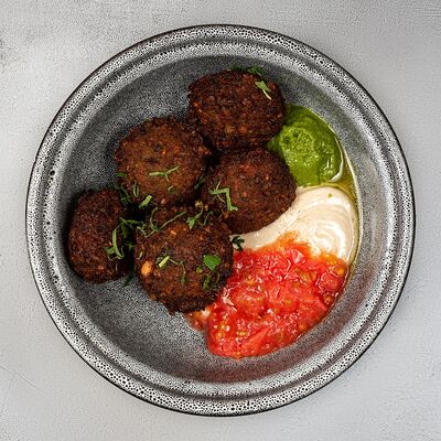 Фалафель с печеными томатами в Dizengof/99 по цене 690 ₽