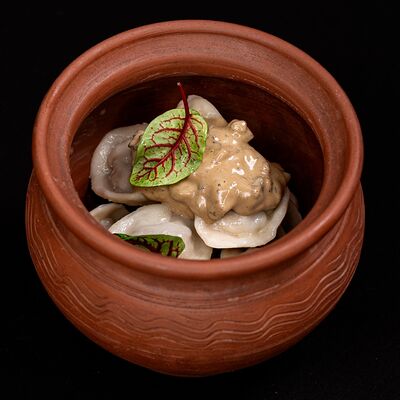 Пельмени с грибным соусом в Сытый кит по цене 500 ₽