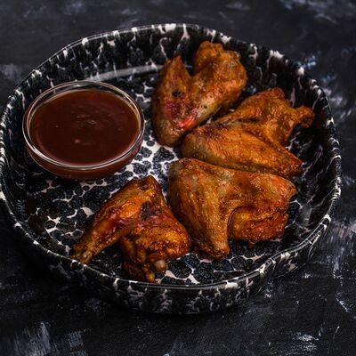 Куриные крылья барбекю в География по цене 390 ₽