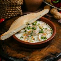 Креветки, запеченные с соусом чкмерули в Дэда