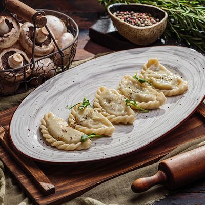 Вареники с картофелем и грибами в Пельмения по цене 483 ₽