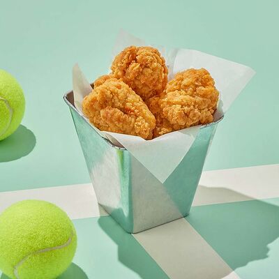 Куриные крылышки в панировке в Dostaевский по цене 562 ₽