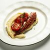 Осьминог с пюре из запеченного картофеля и обжаренными томатами в Итальянец по цене 2150