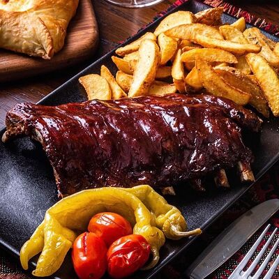 Свиные рёбра Патрон Даш с деревенским картофелем в Чито-Грито по цене 1090 ₽