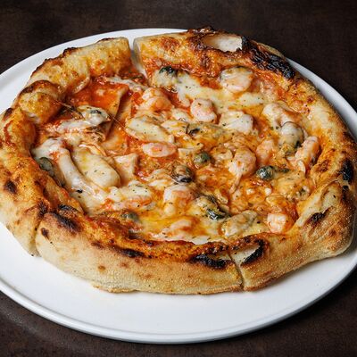 Пицца с морепродуктами в Doge по цене 1070 ₽