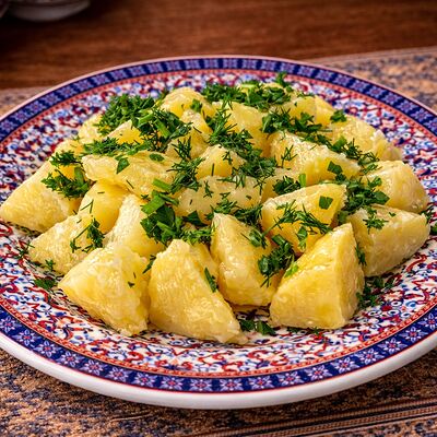 Картофель отварной с зеленью в Тминъ по цене 110 ₽