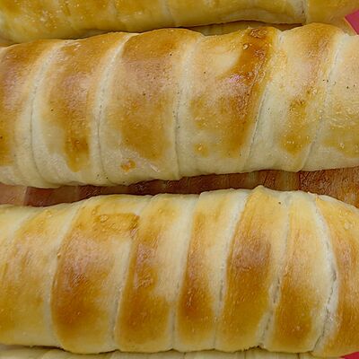 Сосиска в тесте в Тандыр по цене 100 ₽