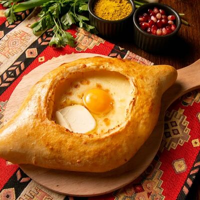 Хачапури по-аджарски в Кура-гриль по цене 500 ₽