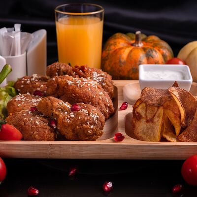 Куриные крылья в панировке в Тесоро по цене 770 ₽