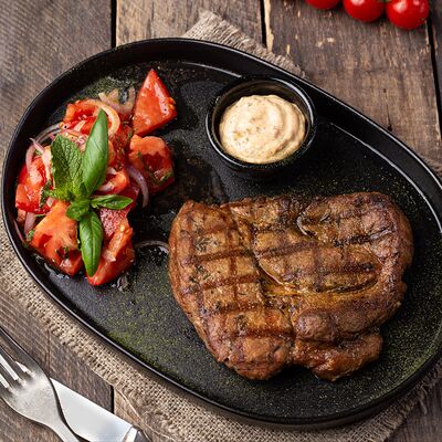 Стейк из свиной шеи в Ганс и Марта по цене 990 ₽