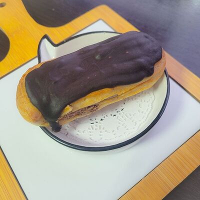 Эклер шоколадный в БлинОК! по цене 109 ₽