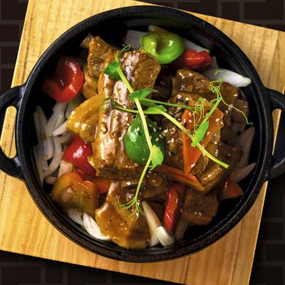 Говяжьи ребра на чугуне в Панда сад по цене 910 ₽