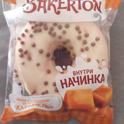Донат глазированный Карамель с начинкойв Кофея по цене 135 ₽