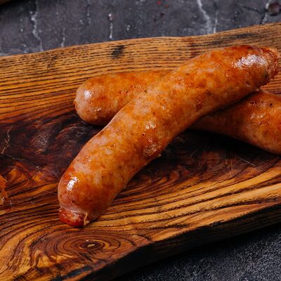 Куриные колбаски с сыром и тушеной капустой в Пламя по цене 1290 ₽