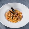 Спагеттини с дарами моря в Болоньетта по цене 1100