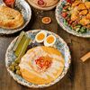 Логотип кафе Taam Hummus Bar