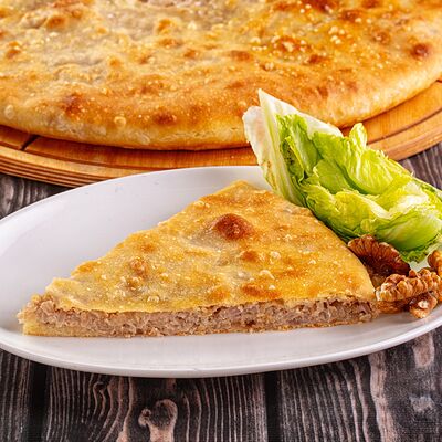 Пирог с капустой и грецким орехомв Осетинские Пироги по цене 1150 ₽