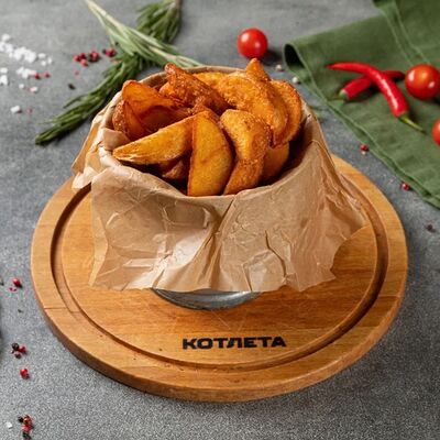 Картофель по-деревенски в Котлета по цене 290 ₽