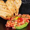 Тартар из лосося с огурцом и кремом из авокадов Lure Oysterbar по цене 1190