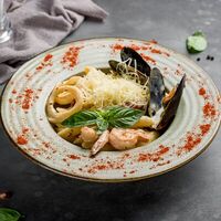 Конкильони с морепродуктами в соусе Белое вино в Arabist
