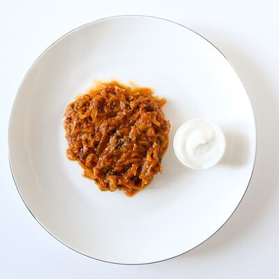 Тушеная капуста со сметаной в Уже готово по цене 120 ₽