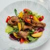 Теплый салат с языком, картофелем, маринованными огурцами и соусом сливочный хренв Лебовски Пицца и Боулинг по цене 650