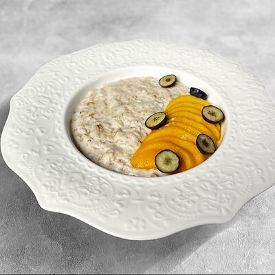 Каша овсяная с персиком в MaMa Mia по цене 378 ₽