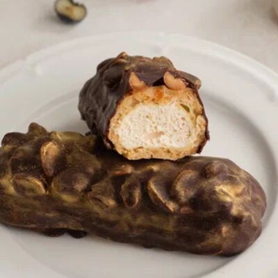 Эклер орехово-карамельный в шоколадев Север-Метрополь по цене 304 ₽