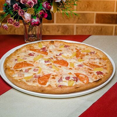 Пицца с ананасом в Пепперони по цене 650 ₽