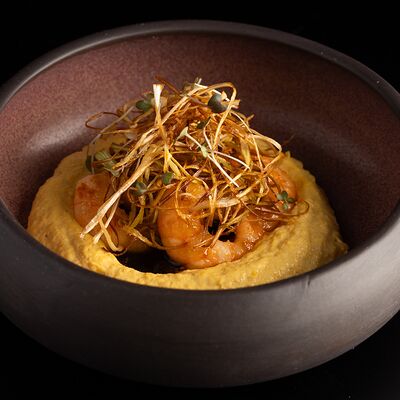 Крем из кукурузы с креветками и сеном из лука-порея в Первый по цене 1040 ₽