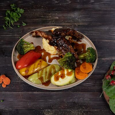 Свиные ребрышки в соусе барбекю в Ассадо по цене 820 ₽