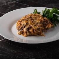 Свинина, запеченная под грибами и сыром в Оливье