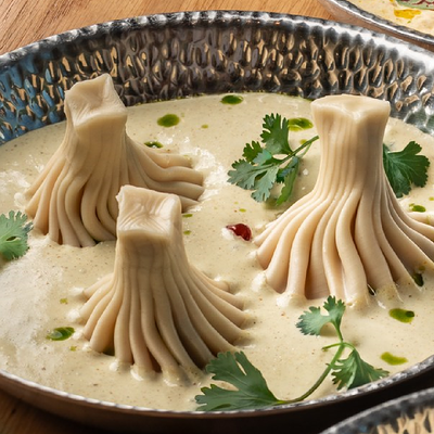 Хинкали с соусом чкмерули в ЮжанеГорожане по цене 678 ₽