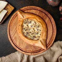 Хачапури по-аджарски с жюльеном из курицы в Gaumarjos