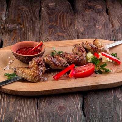 Куриные крылышки острые в У Ханумы по цене 490 ₽