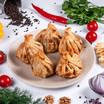 Жареные хинкали со свининой и говядиной в Тамада по цене 700 ₽