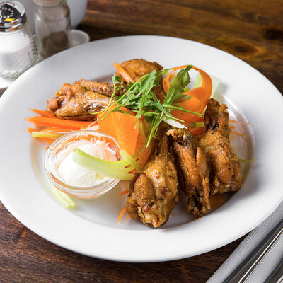 Копченые куриные крылышки в Кафе RSC по цене 230 ₽