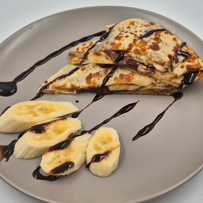 Блин с бананом и орехово-шоколадной пастой в Mille по цене 255 ₽