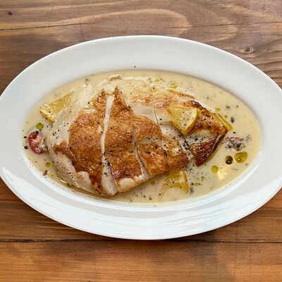 Цыпленок с сольными лимонамив Прошуттерия по цене 970 ₽