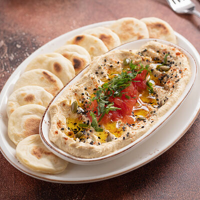 Хумус с томатами и оливковым маслом в Сандуны Урал по цене 670 ₽