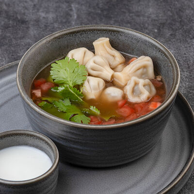 Наваристый бульон из говядины с мини-хинкали в Бумбараш по цене 390 ₽