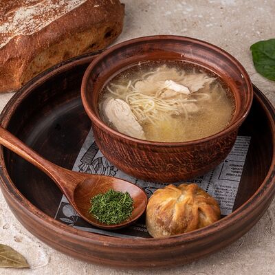 Суп-лапша с курицей и пирожком с грибами в Русская усадьба по цене 415 ₽